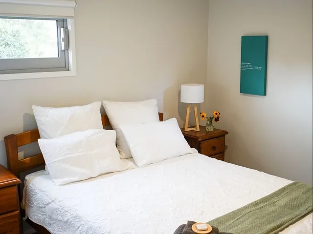 Bedroom with a double bed and garden-facing window