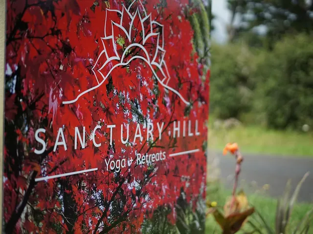 Sanctuary Hill sign among the gardens