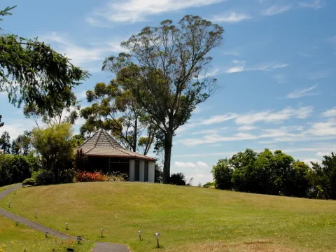 A garden path leading to a small pavilion at Tauhara