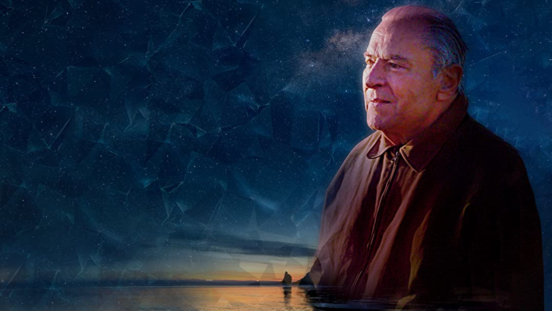 Stanislav Grof against a landscape and starry background
